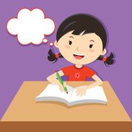 Cute girl writing at her desk