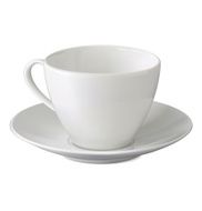 Empty white cup and saucer on background