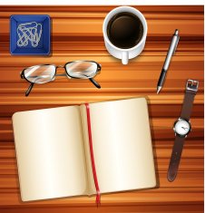Notebook on table with other accessories N2