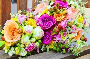 Peonies and colorful roses in a bouquet