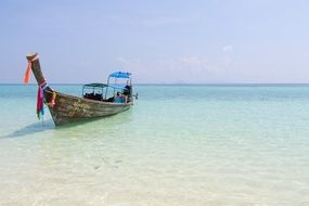 Colorful ship on the beautiful waterscape with green and blue water