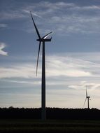 Wind turbines against the background of a cloudy sky