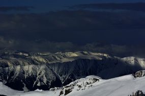 Snow-capped peaks of picturesque mountains