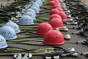 red and blue climbing helmets