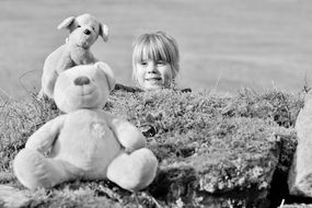 child girl face stuffed animals black and white view