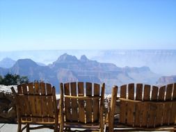 wooden chairs in the grand canyon