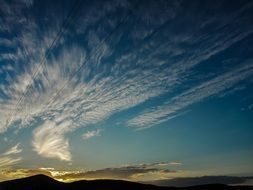 feather clouds in the sunny sky