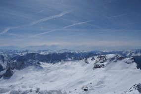 blue sky above tall white Alps