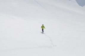 the skier descends the snowy mountain
