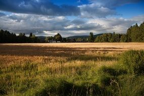 cloudy sky over meadows in the countryside