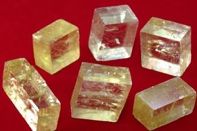 calcite stones on a red background