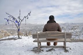 man resting on the bench