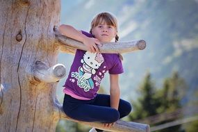 Climbing child on a tree