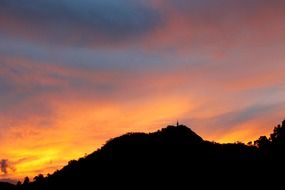 Beautiful, bright, orange, yellow and red sunset over the hills in Gampola, Sri Lanka