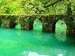 photo of a stone mots across the river in Libo County, China