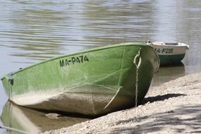 green fishing boat on the lake in Germany on a sunny day