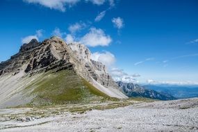 scenic rock with green side in wilderness