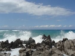 ocean splashes along the shore
