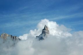 fog over the top of the mountain in italy