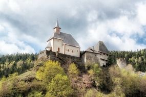 Church on a hill among the forest