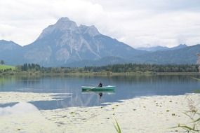 rower on a mountain lake in Allgau