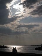 silhouettes on the sunset sea
