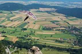 hang glider flies over the mountains