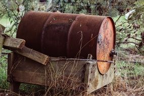 metal barrel in wooden box