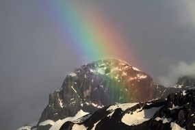 Rainbow on the alpine mountains