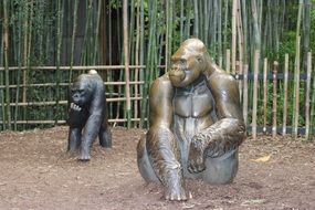 two bronze gorilla sculptures in the park