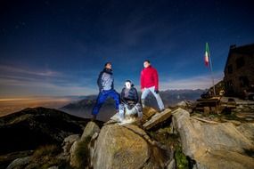 men at night on top of the mountain