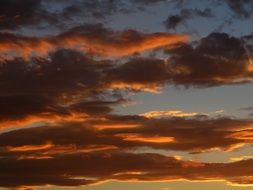 romantic clouds backlit by the colorful sun