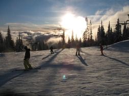 skiers speeding down the mountain, canada