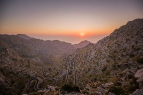 Panorama of a winding road among mountains and valleys