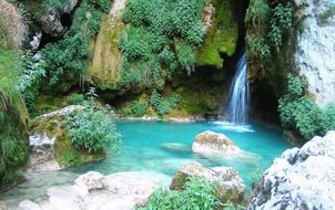 panorama of the picturesque turquoise waterfall