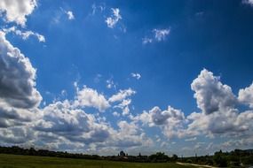 skyscape with clouds above meadow