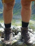 mountaineering shoes on legs