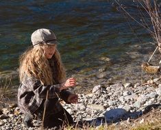 girl with pancake blond hair by the lake