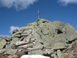 cross on stone slabs in the Alps