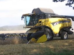 combine for harvesting grain on the field