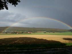 rainbow over rural landscape