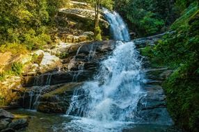 waterfall on the rocks background