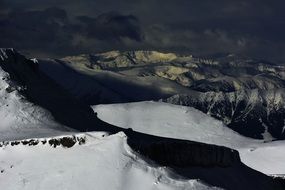 Mountain snow-capped peaks at dusk