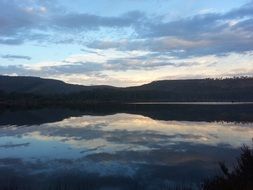 reflection of peaceful sunrise in a water