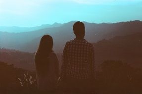 guy and girl looking at mountain Landscape
