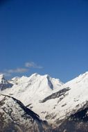 photo of snow on the tops of the Alps