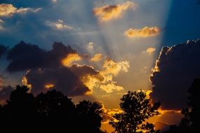 Colorful sunset rays in the clouds