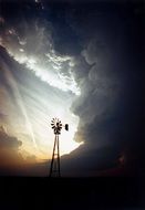 windmill silhouette on a background of clouds