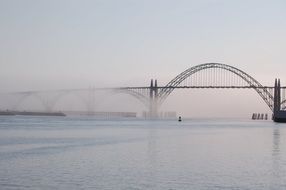 big bridge across the Pacific Ocean in the fog