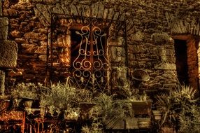 Flower decoration of the window of stone building